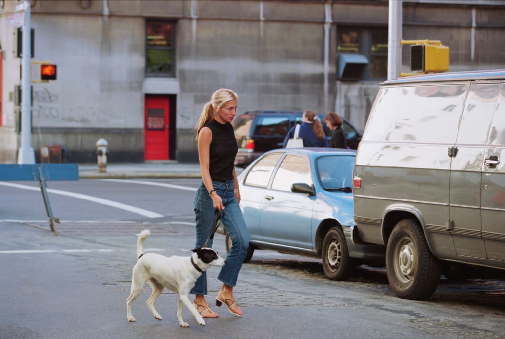 Carolyn Bessette-Kennedy walks her and her husband John F. Kennedy Jr.'s dog in New York on October 5, 1996.