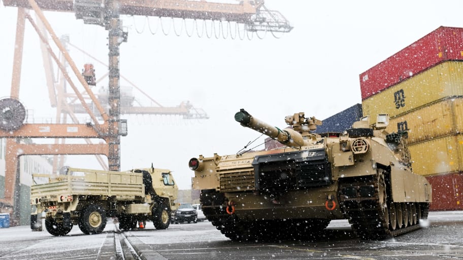 A M1A2 Abrams battle tank of the US army that will be used for military exercises by the 2nd Armored Brigade Combat Team, is unloaded at the Baltic Container Terminal in Gdynia on December 3, 2022.