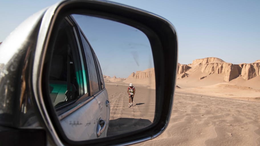 A runner in a side mirror in the Dasht-e Lut Desert.