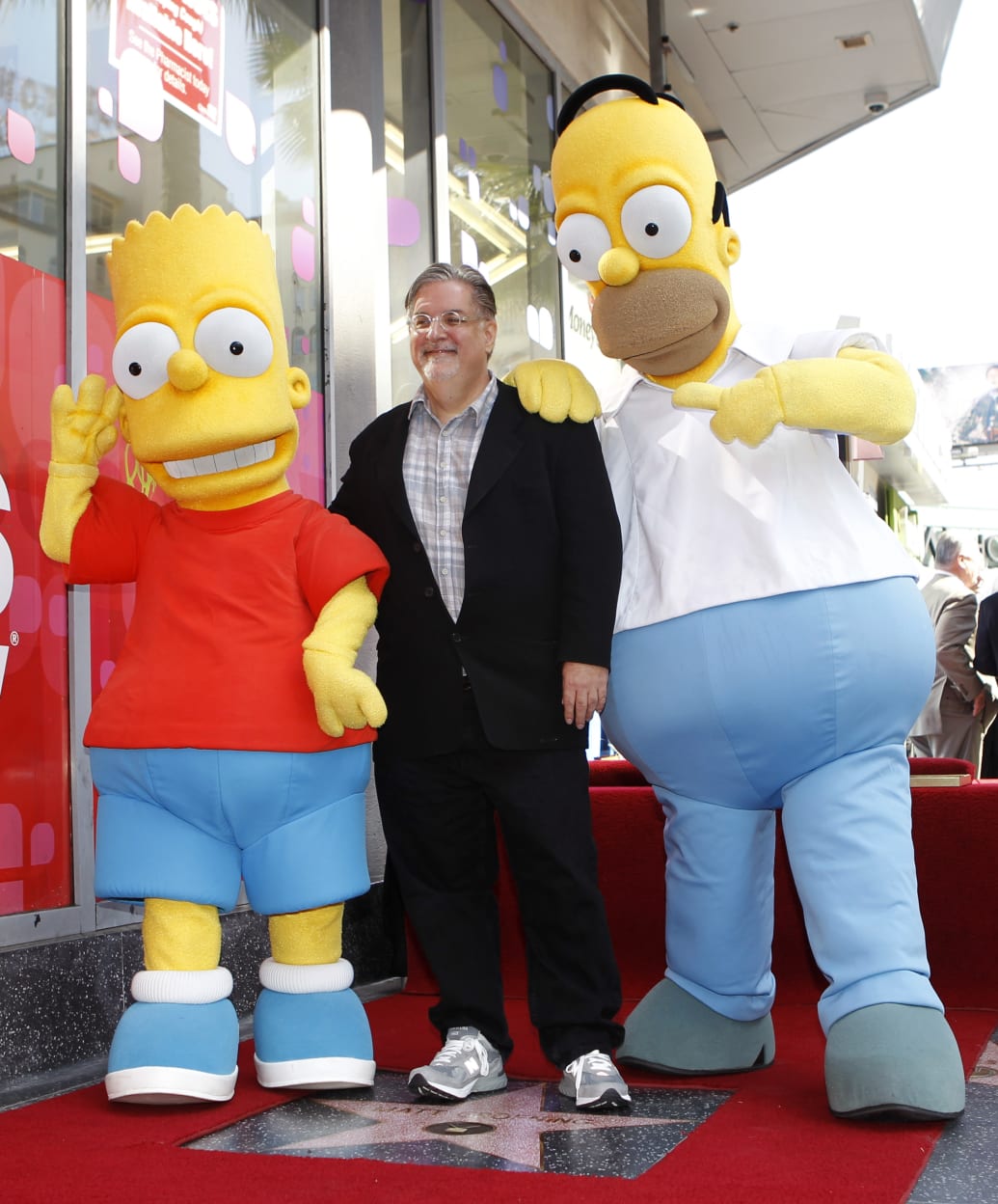 Matt Groening with Homer and Bart Simpson