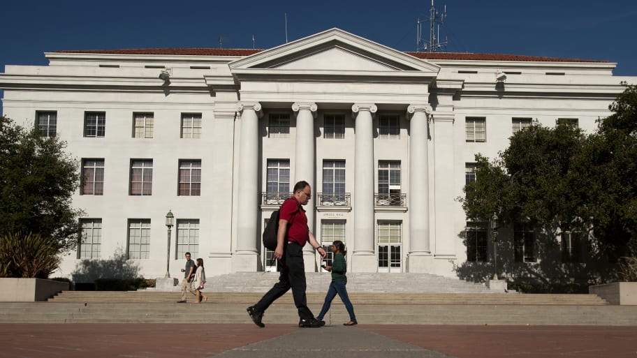 Pedestrians pass Sproul Hall, the University of California at Berkeley's administration building.
