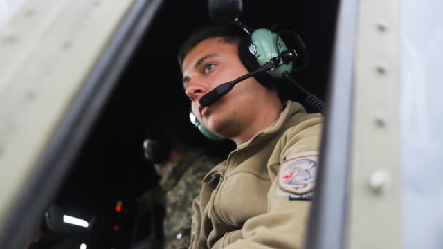 A photograph of Andriy, a member of Ukraine's 10th Army Aviation Brigade.