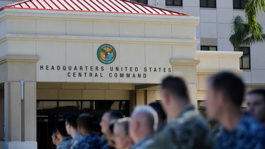 U.S. military personnel stand outside the U.S. Central Command (CENTCOM) and Special Operations Command (SOCOM) headquarters in Tampa, Florida, U.S., February 6, 2017.