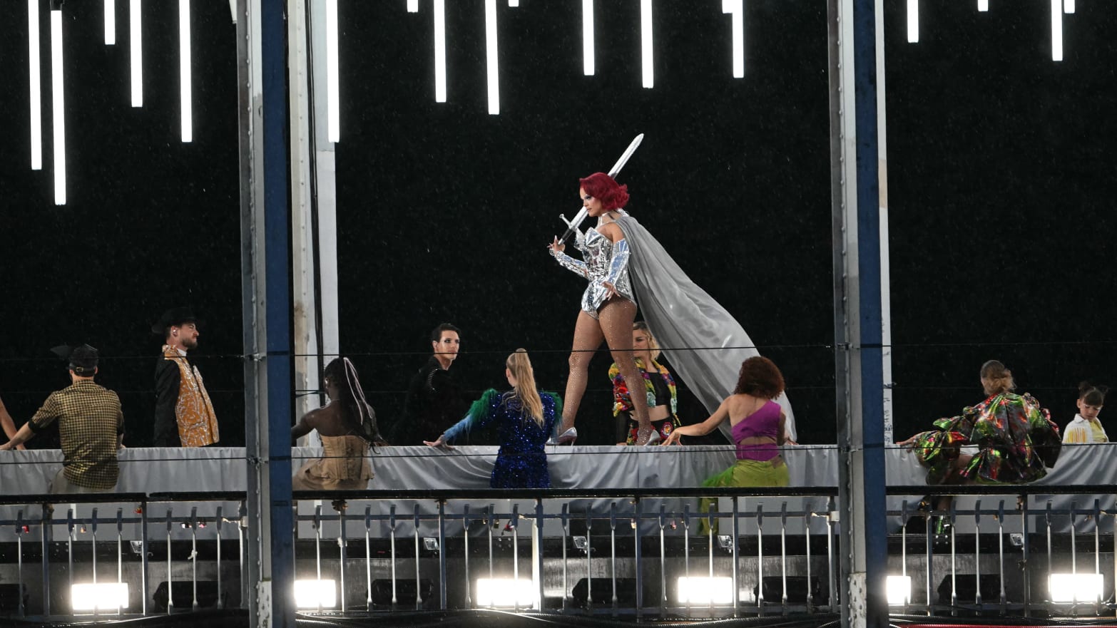 A model walking on a catwalk during the Olympics opening ceremony in Paris. 