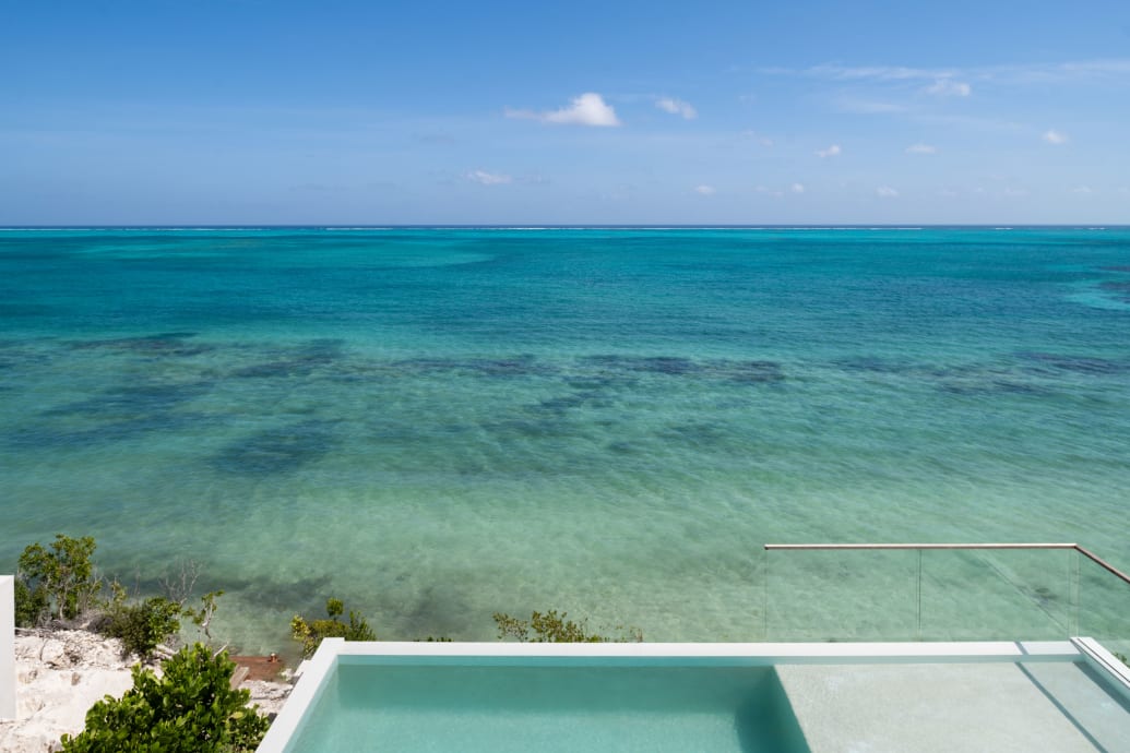 A view of the pool and ocean from one of the Beach Enclave North Shore’s villa properties.