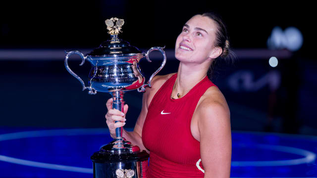 Aryna Sabalenka poses with the Daphne Akhurst Memorial Cup after winning her Women's Singles Final match at the 2024 Australian Open.