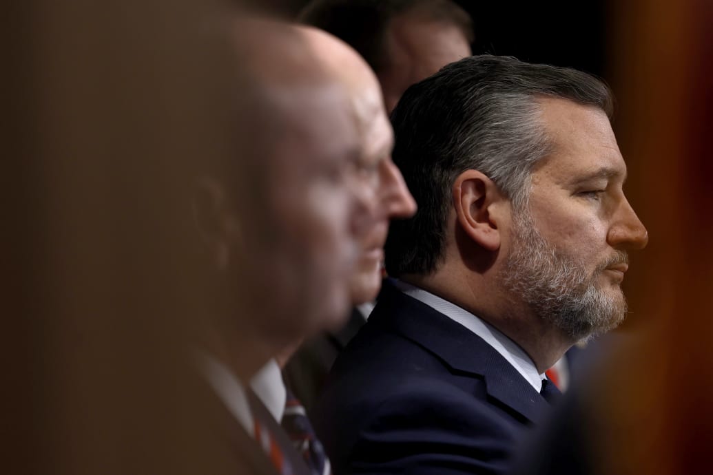 Sen. Ted Cruz (R-TX) listens during a news conference at the U.S. Capitol.