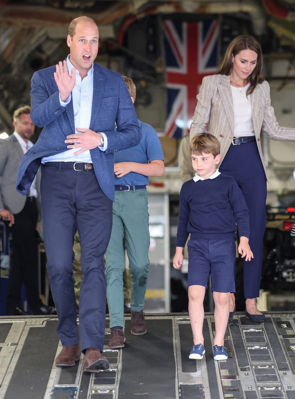 Britain's Prince William, Prince of Wales and Catherine, Princess of Wales with Prince Louis of Wales as they walk down the ramp of a C17 plane during their visit to the Air Tattoo at RAF Fairford on July 14, 2023 in Fairford, Britain.