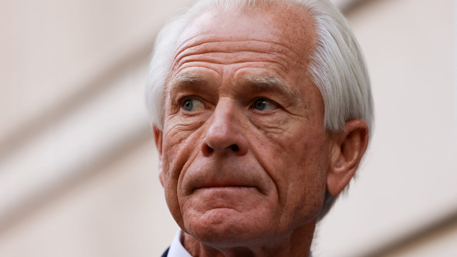 Peter Navarro speaks to reporters outside a federal courthouse.