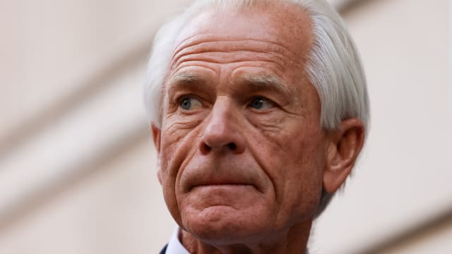 Peter Navarro speaks to reporters outside a federal courthouse.