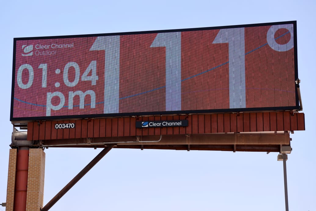 Billboard displays temperature as Phoenix breaks heat record of 19 consecutive days above 110 degrees Fahrenheit.
