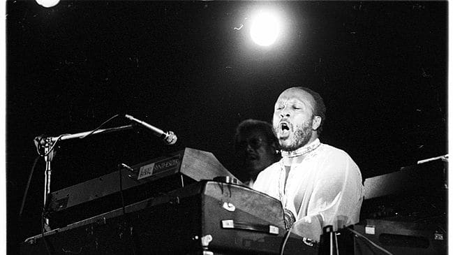 A black-and-white photo of Les McCann at the piano.