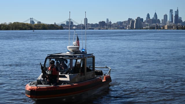 A U.S. Coast Guard boat patrols the Delaware River on October 13, 2023, in Philadelphia, Pennsylvania.