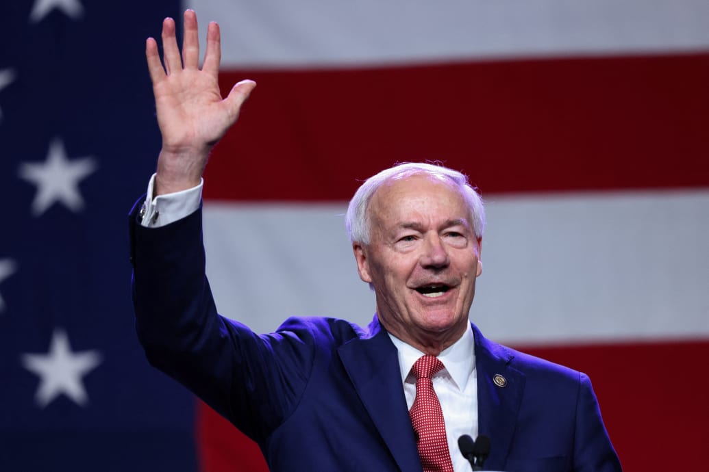 Former Arkansas Governor and Republican presidential candidate Asa Hutchinson gestures as he speaks at the Republican Party of Iowa's Lincoln Day Dinner in Des Moines, Iowa