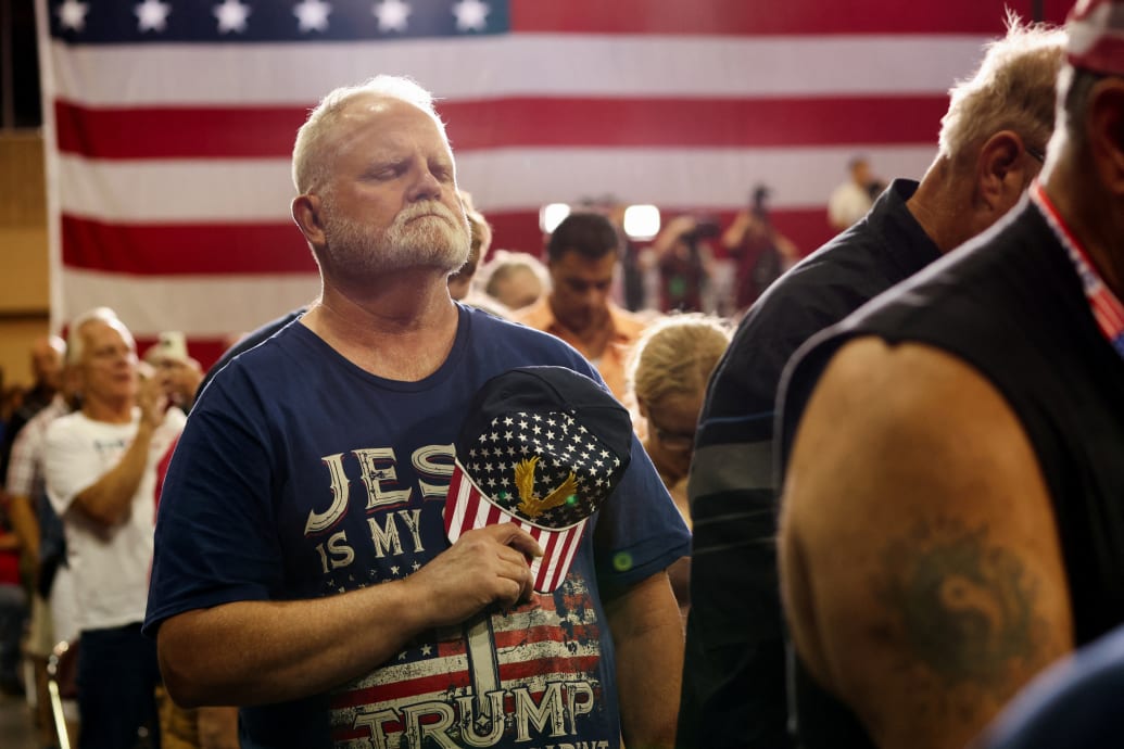 An attendee reacts as former U.S. President and Republican presidential candidate Donald Trump holds a campaign rally in Erie, Pennsylvania.