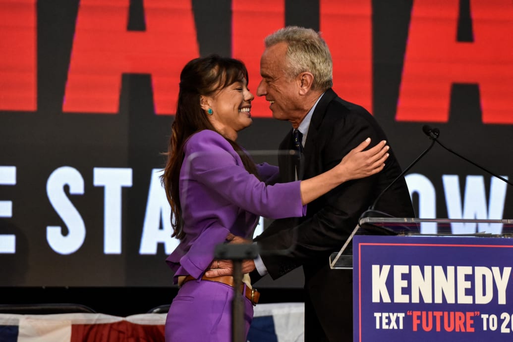 Robert F. Kennedy Jr. and his running mate, Nicole Shanahan, embrace on stage