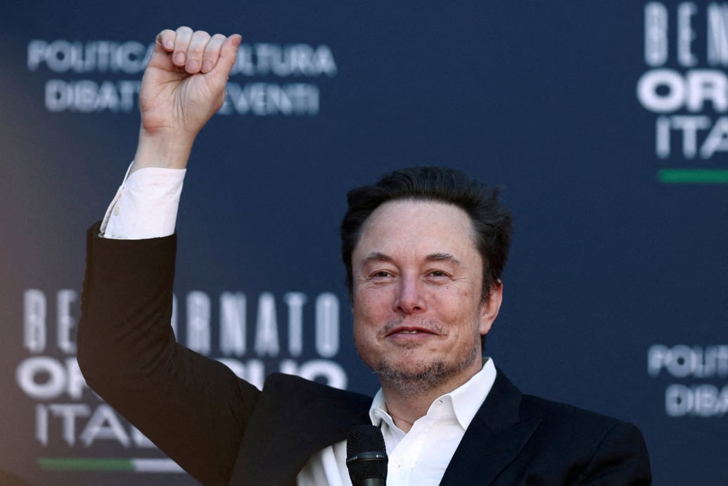 Tesla and SpaceX CEO Elon Musk gestures as he attends a political festival in Rome. 