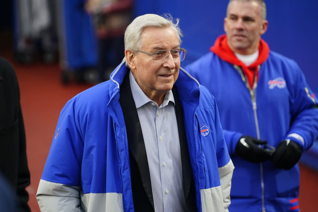 Terry Pegula walks on the sideline at a Buffalo Bills game.