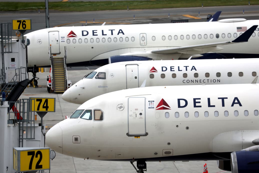 Parked Delta passenger jets pictured in June 2022.