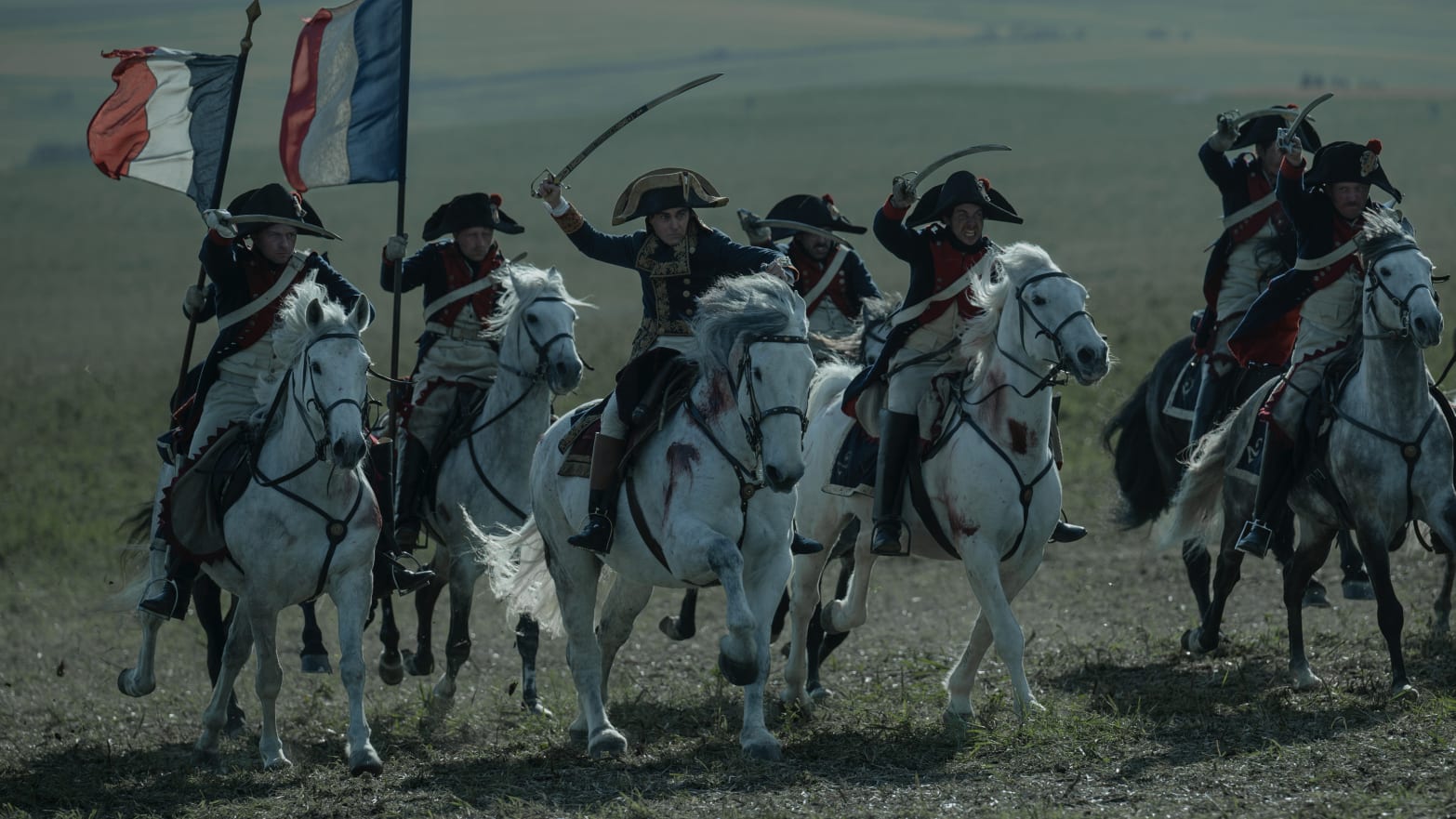 Joaquin Phoenix and an army of men on horses in a scene from 'Napoleon'