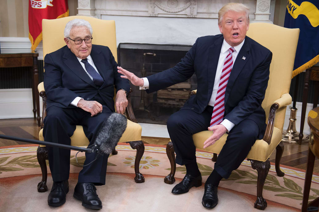 President Donald Trump speaks with former Secretary of State Henry Kissinger during a meeting in the Oval Office, May 10, 2017. 