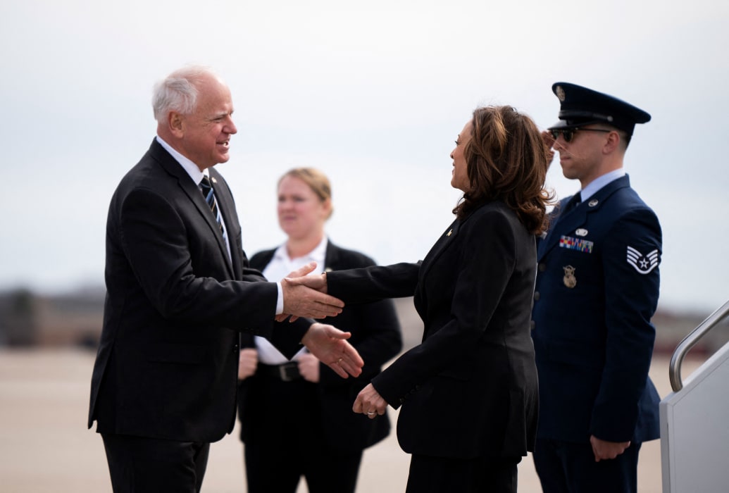 Tim Walz greets Kamala Harris