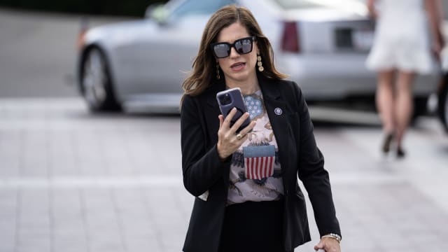 Nancy Mace (R-SC) looks at her phone as she walks to the Capitol for a motion to vacate aimed at House Speaker Kevin McCarthy