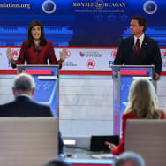 Former South Carolina Governor Nikki Haley speaks as former New Jersey Governor Chris Christie and Florida Governor Ron DeSantis listen during the second Republican candidates' debate