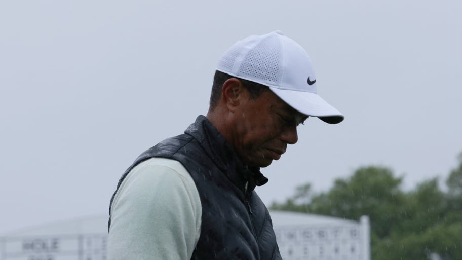 Tiger Woods stands outside during a match.