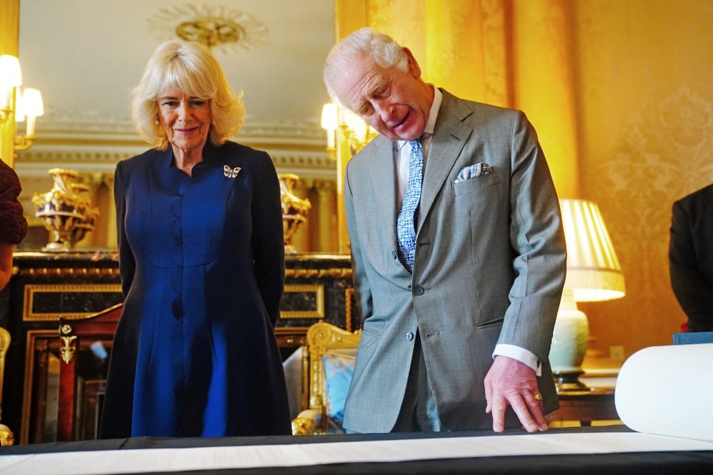 King Charles and Queen Camilla are presented with the Coronation Roll, an official record of their Coronation, by the Clerk of the Crown in Chancery, at Buckingham Palace, central London, Britain May 1, 2024.