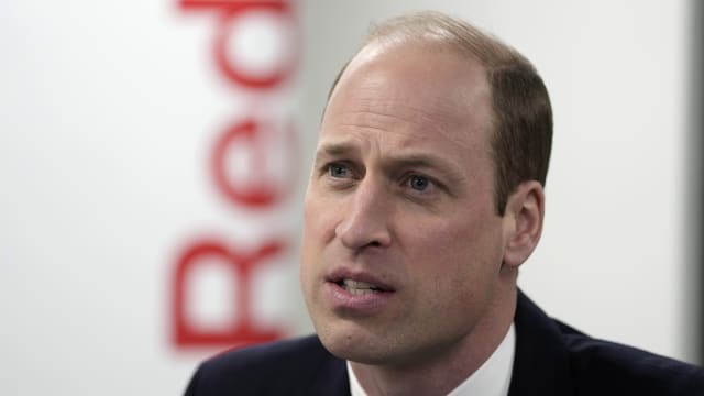 Prince William, The Prince of Wales, listens as he visits the British Red Cross at British Red Cross HQ on February 20