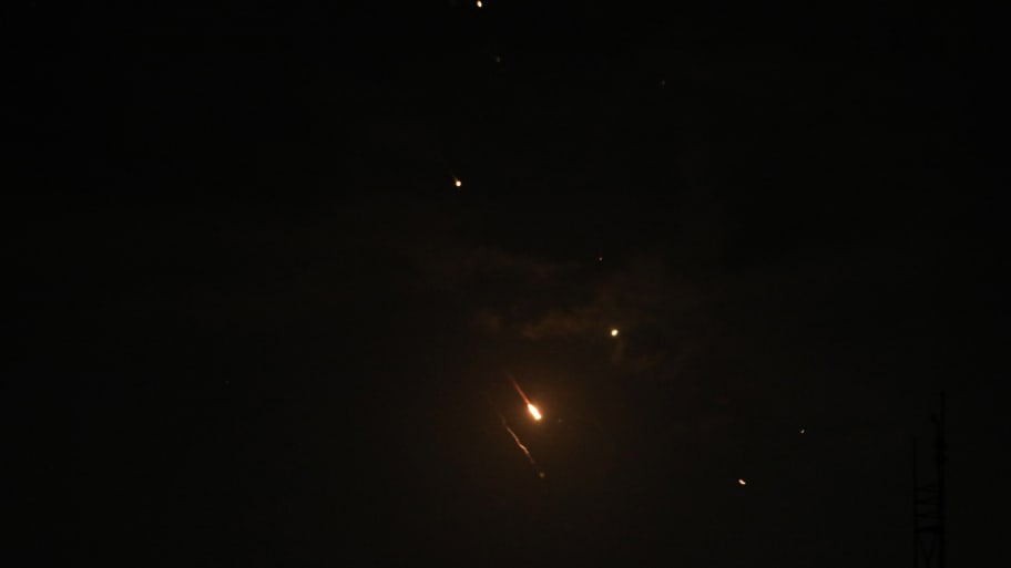 Missiles are seen in the skies of Gaza City following the attack from Iran, in Gaza on April 14, 2024.