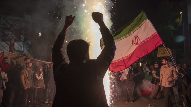 People gather in support of Iran’s strikes on Israel in Tehran.