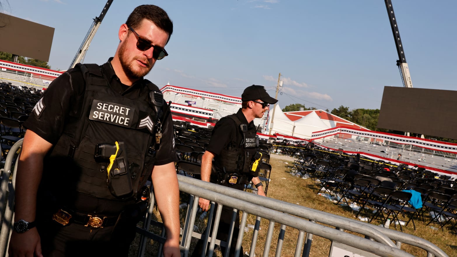 Secret Service agents walk in aftermath of Trump rally shooting.