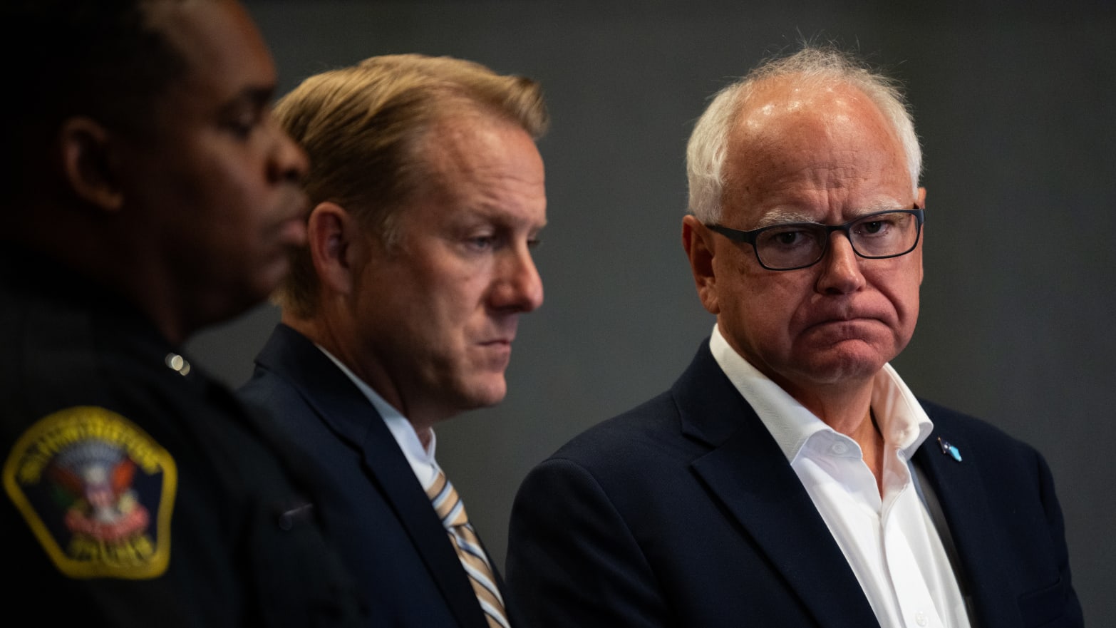 Minnesota Governor Tim Walz (R) listens during a press conference regarding new gun legislation at the Bloomington City Hall on August 1, 2024 in Bloomington, Minnesota. 