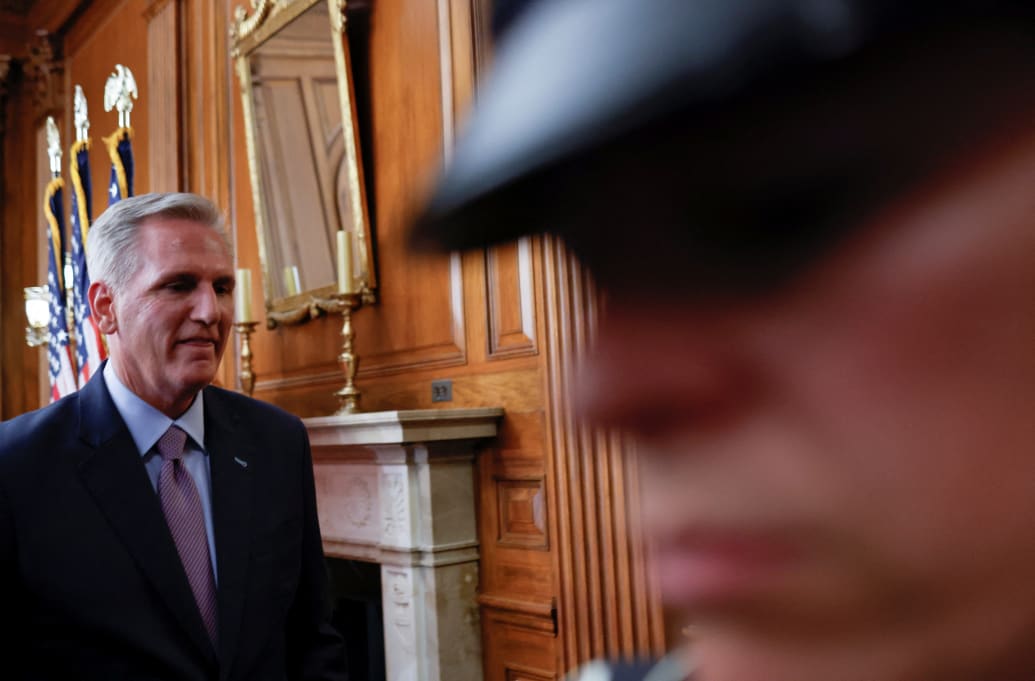 Former Speaker of the House Kevin McCarthy (R-CA) walks past a U.S. Capitol police officer as he departs after concluding a press conference