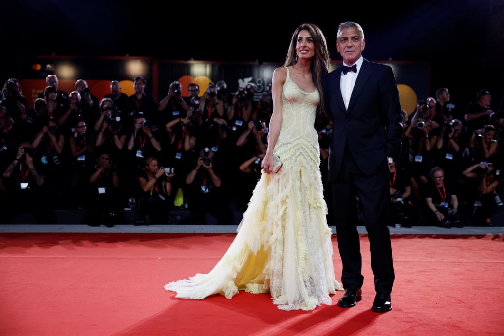 George and Amal Clooney pose on the red carpet during the Venice Film Festival on September 1, 2024.