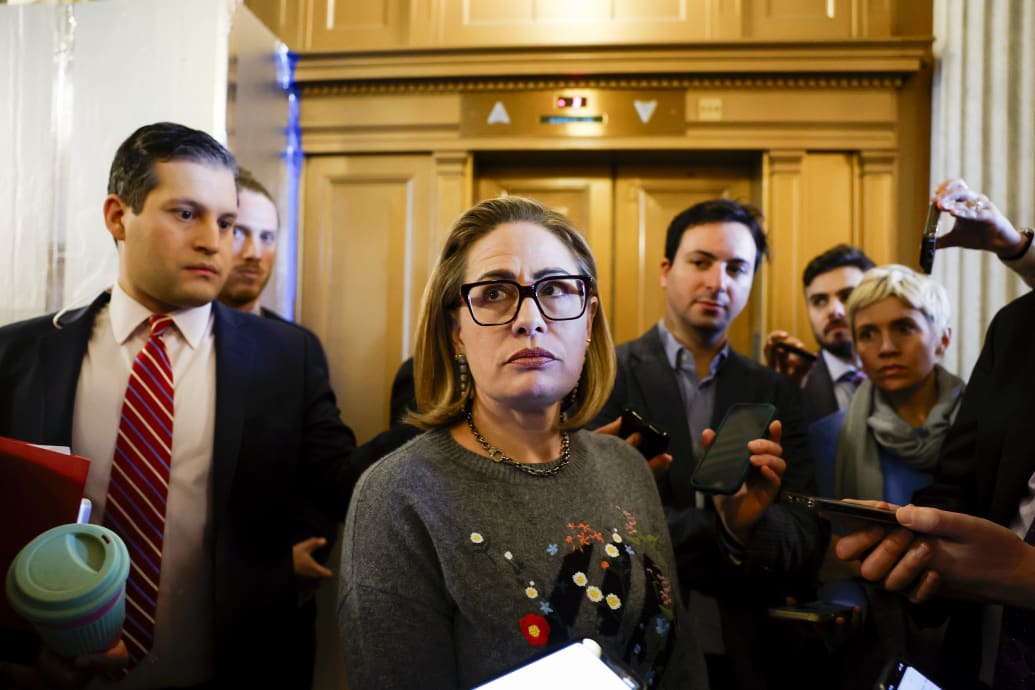 Sen Kyrsten Sinema (I-AZ) speaks to reporters during a vote in the Senate Chambers.