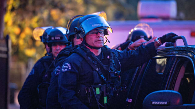 LAPD officers in riot gear exit USC after they cleared out a pro-Palestinian protest encampment on Sunday, May 5, 2024 in Los Angeles, CA.