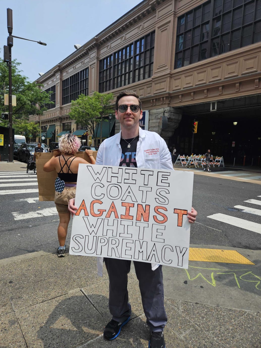 A doctor protested against Moms For Liberty at the group’s summit in Philadelphia.