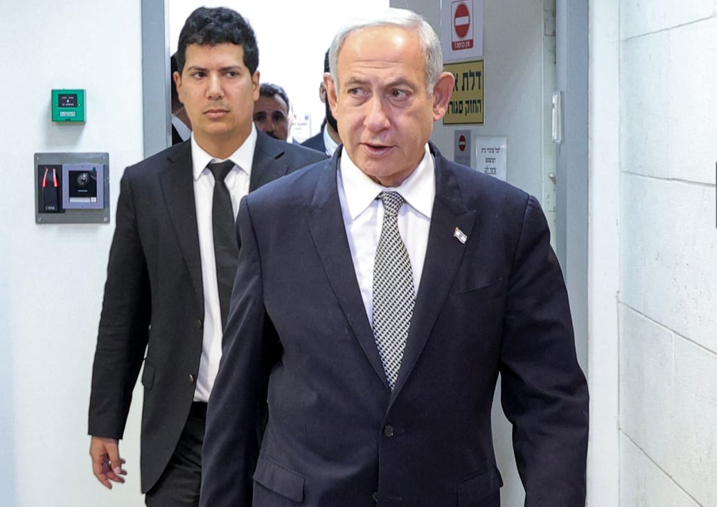 A photo of Israeli Prime Minister Benjamin Netanyahu arriving for a hearing.