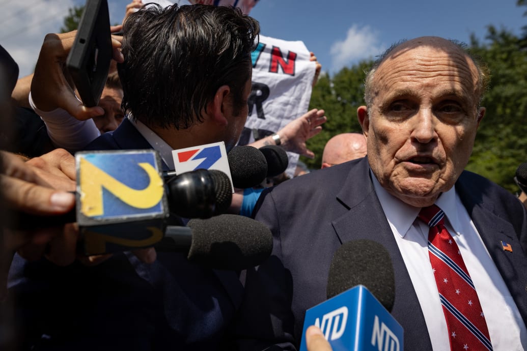 Rudy Giuliani speaks to reporters outside the Fulton County Jail.