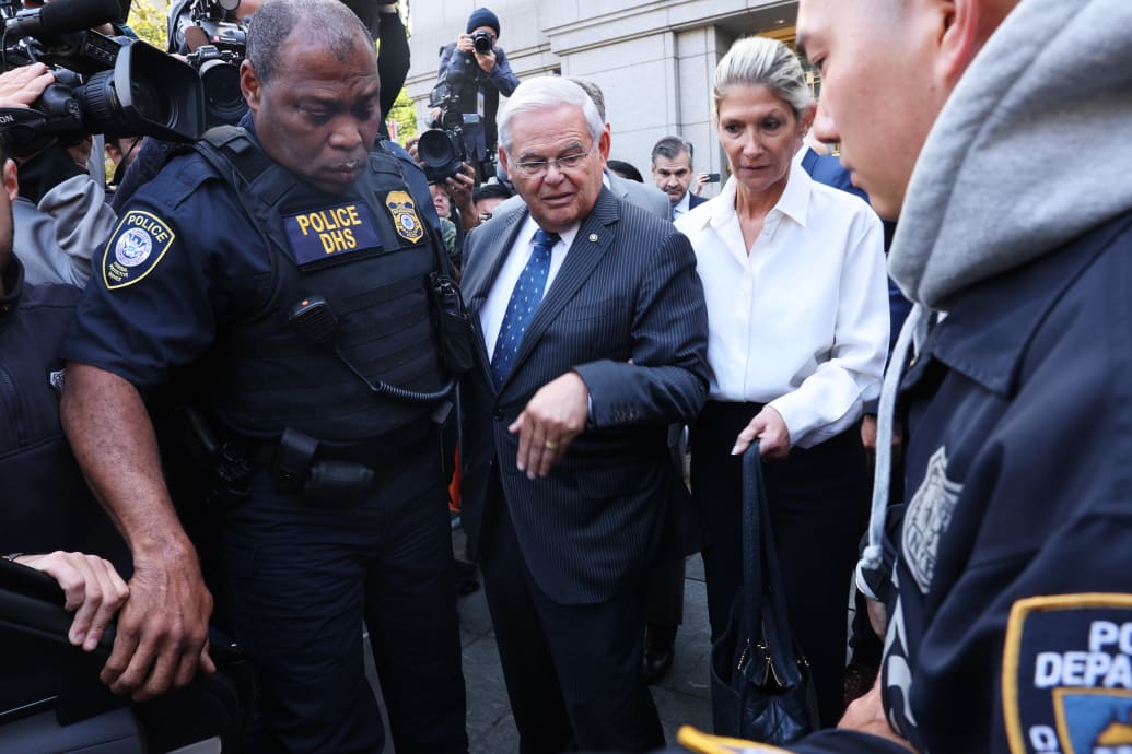 A photo including Senator Bob Menendez and his wife Nadine Menendez leaving a Manhattan Court