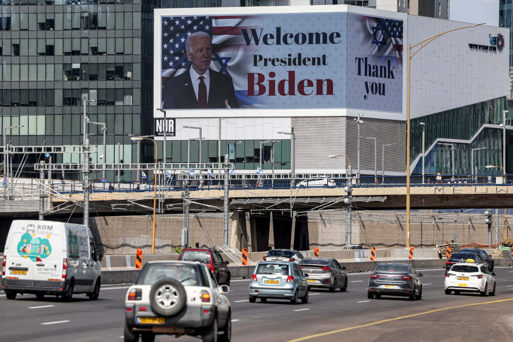 A photo including a billboard welcoming US President Joe Biden in Tel Aviv