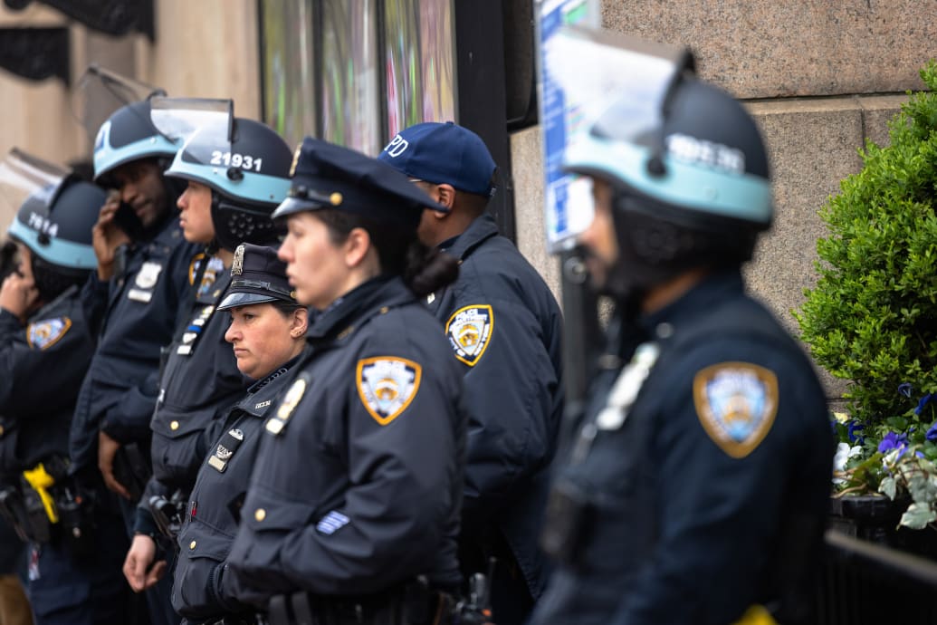 NYPD officers stand guard outside of Columbia University on April 24.