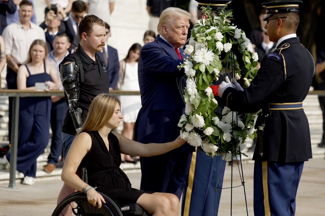 Donald Trump alongside two injured Marines