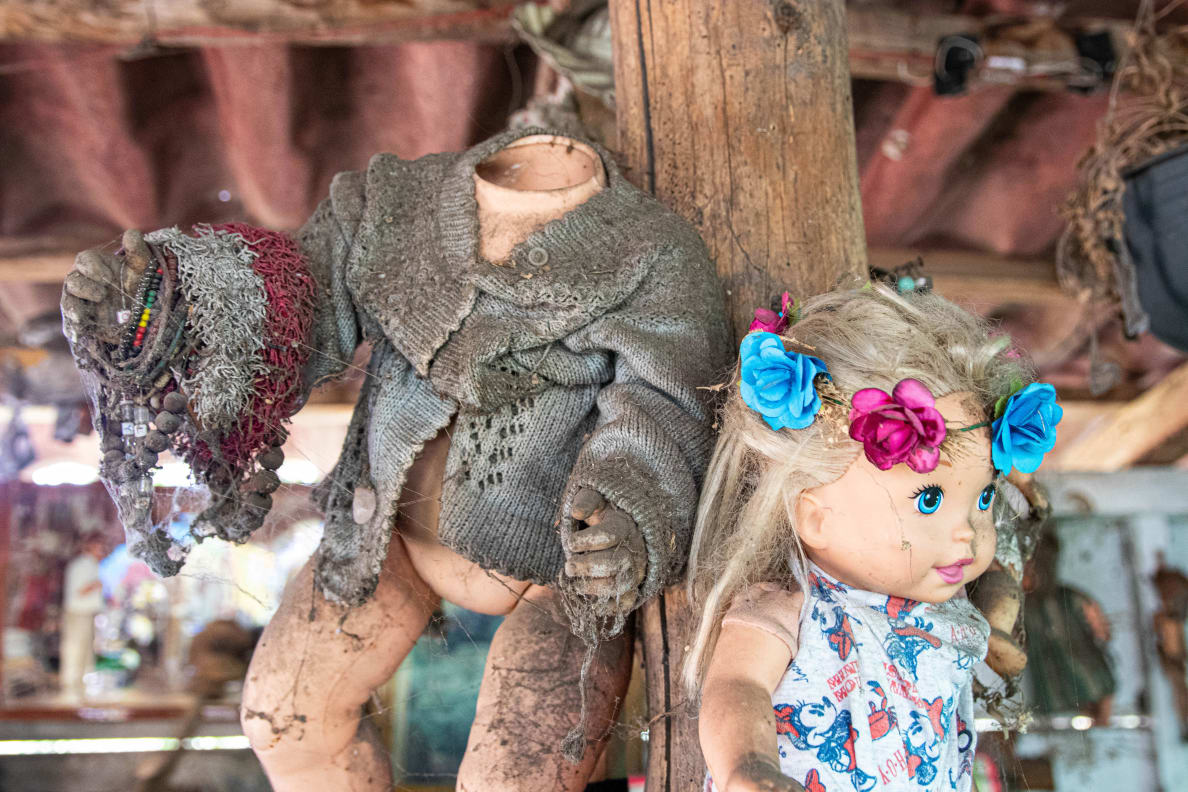 Photograph of dolls hanging on Isla de las Munecas.