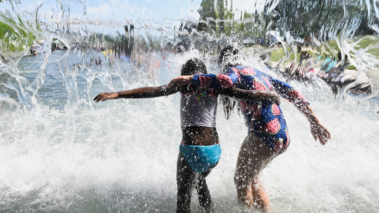 Children splash in the water to cool off from the heat wave in Washington, DC, earlier this week. 