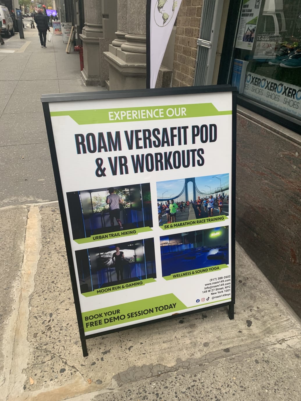 A sign outside Roam149 advertises pod and VR exercises in virtual environments including the lunar surface.