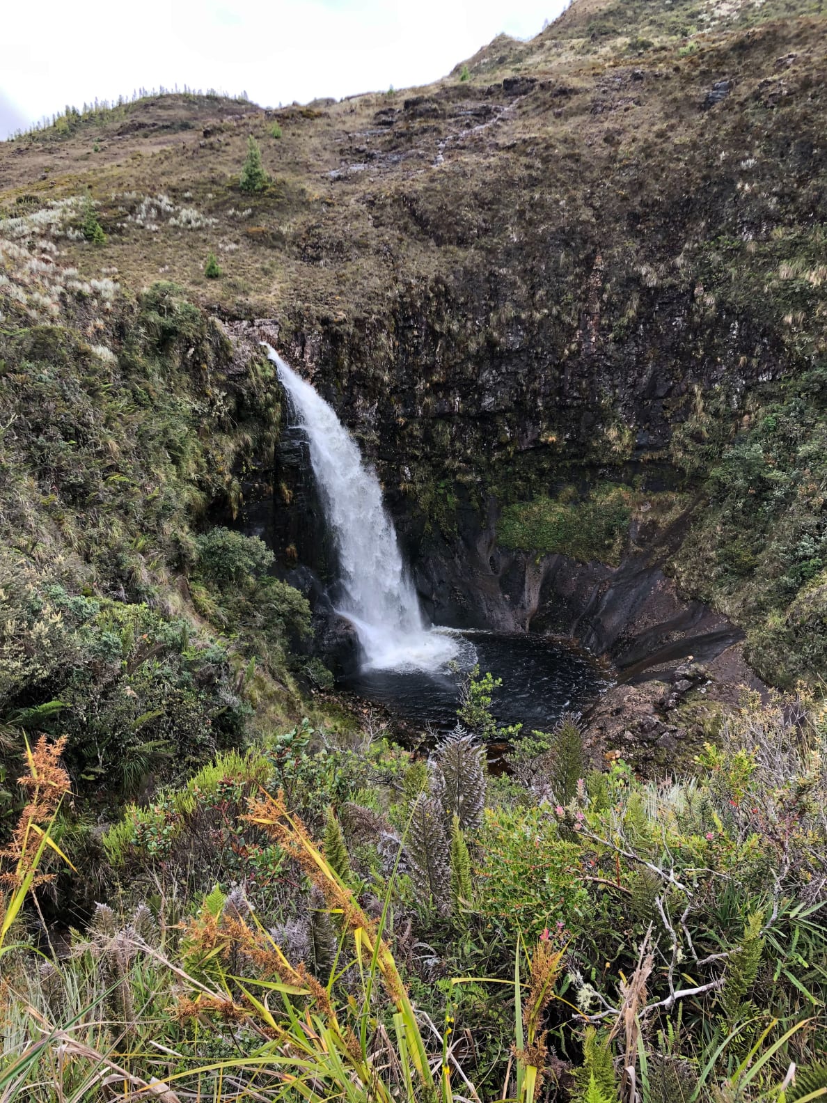 A photograph of a waterfall along the Inca trail near Ona.